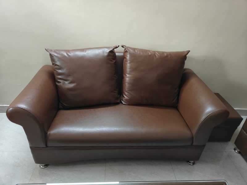 2 sets of 2 seater sofa and a center table for sale. leather made